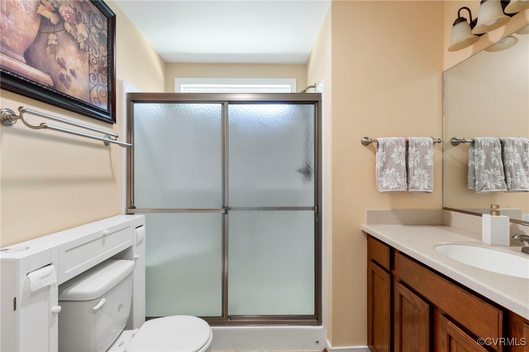 2901 Kingsdale Road North Chesterfield, VA 23237 - Photo 8 of 22 a bathroom with a granite countertop sink toilet and shower