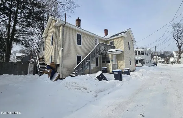a view of a house with a snow