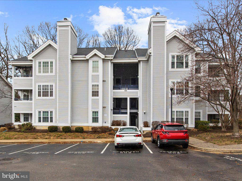 602 Moonglow Road, Unit 101 Odenton, MD 21113 - Photo 1 of 30 a car parked in front of a white building