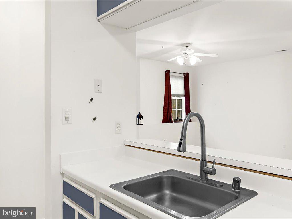 602 Moonglow Road, Unit 101 Odenton, MD 21113 - Photo 12 of 30 a kitchen with a sink and a refrigerator
