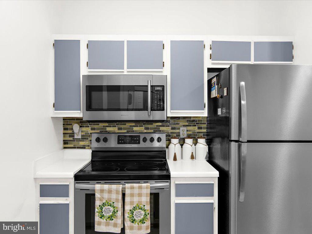 602 Moonglow Road, Unit 101 Odenton, MD 21113 - Photo 14 of 30 a kitchen with a stove and a microwave