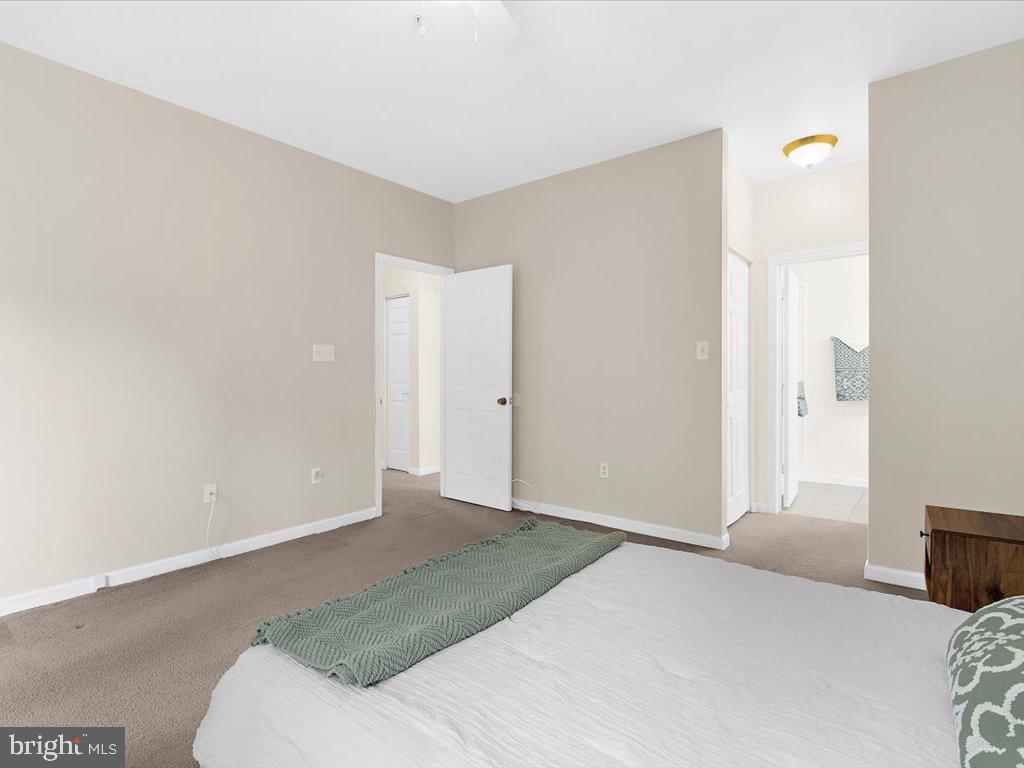 602 Moonglow Road, Unit 101 Odenton, MD 21113 - Photo 17 of 30 a bedroom with a bed and a window