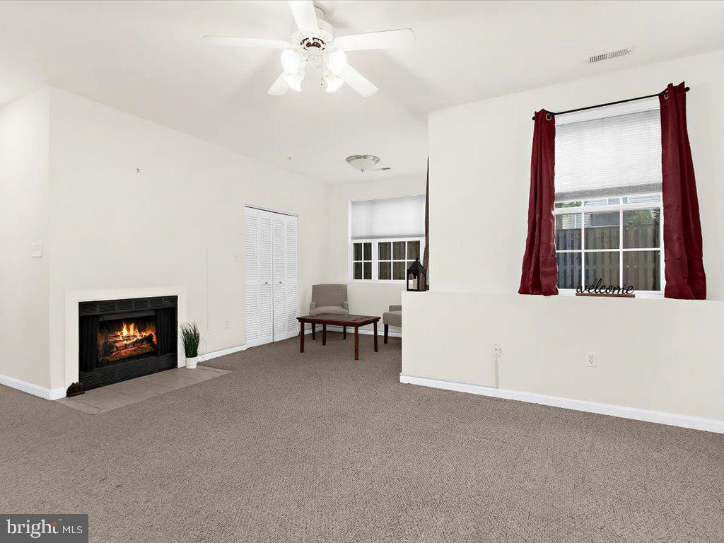 602 Moonglow Road, Unit 101 Odenton, MD 21113 - Photo 2 of 30 a view of livingroom with furniture and a fireplace