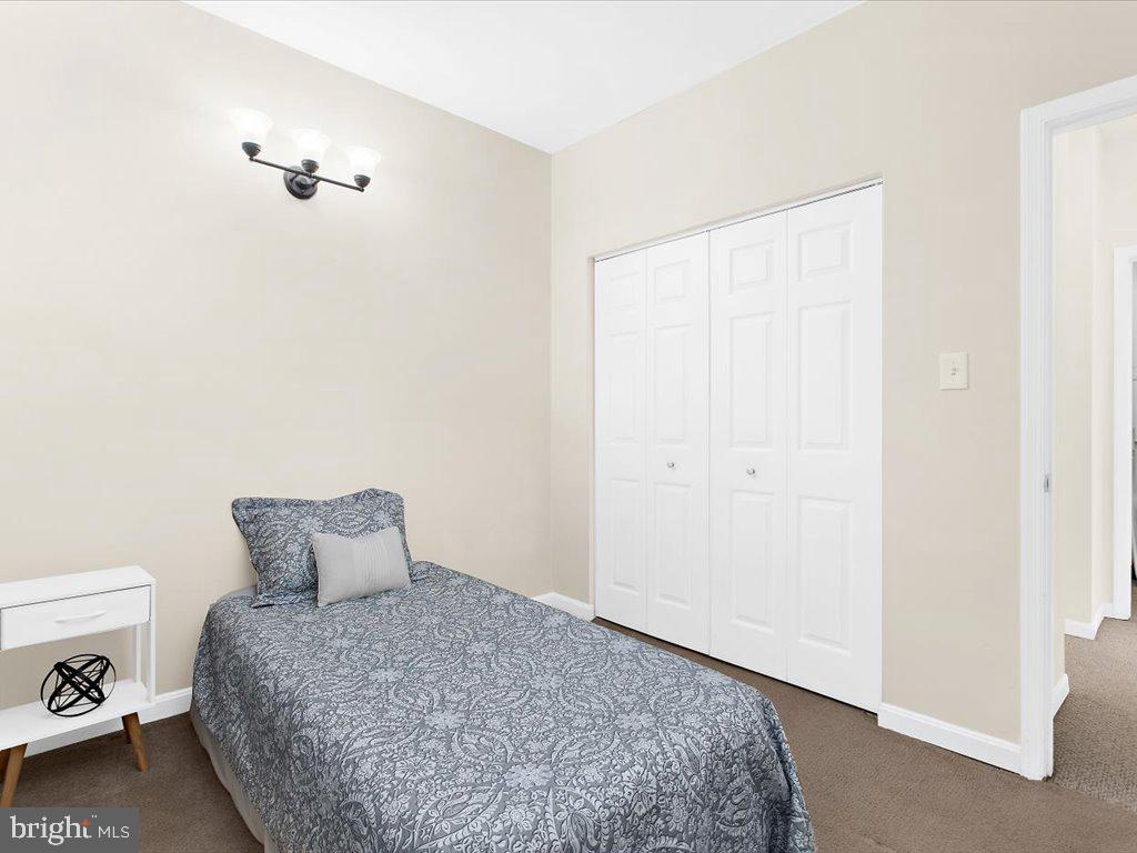 602 Moonglow Road, Unit 101 Odenton, MD 21113 - Photo 21 of 30 a bedroom with a bed and a closet