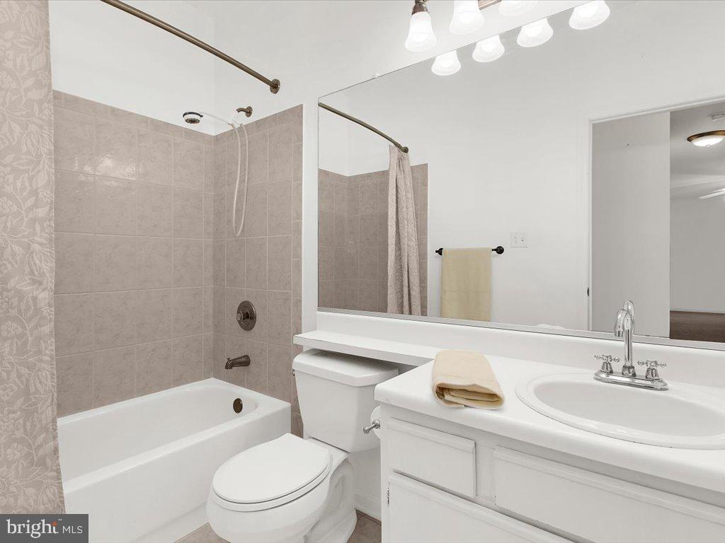 602 Moonglow Road, Unit 101 Odenton, MD 21113 - Photo 22 of 30 a bathroom with a sink a toilet and shower