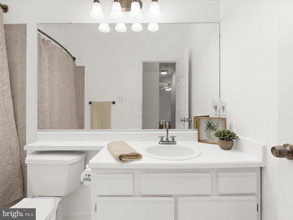 602 Moonglow Road, Unit 101 Odenton, MD 21113 - Photo 23 of 30 a bathroom with a sink and a mirror