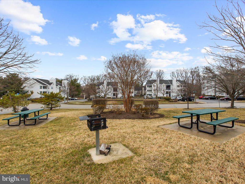 602 Moonglow Road, Unit 101 Odenton, MD 21113 - Photo 28 of 30 a view of a lake with outdoor seating