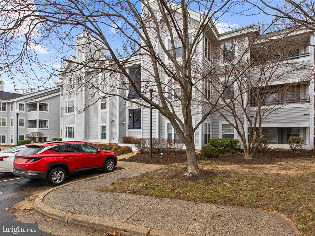 602 Moonglow Road, Unit 101 Odenton, MD 21113 - Photo 30 of 30 a car parked in front of a building