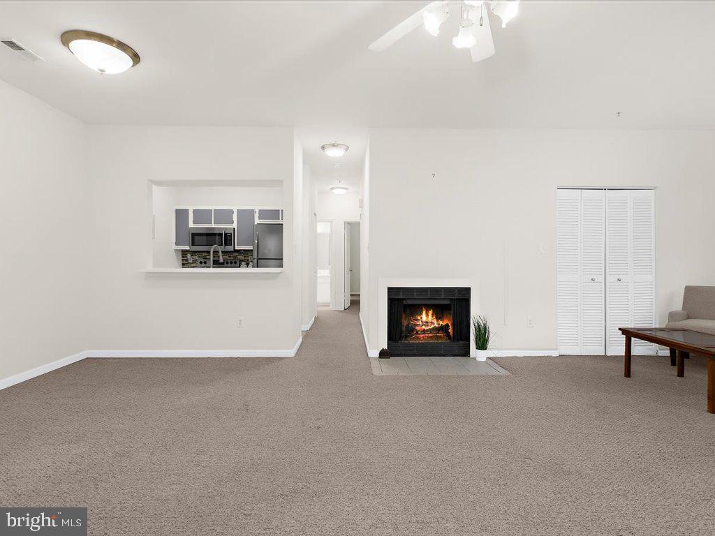 602 Moonglow Road, Unit 101 Odenton, MD 21113 - Photo 7 of 30 a view of a livingroom with a fireplace and window
