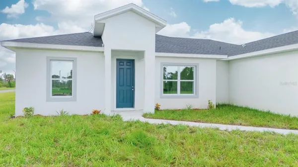 a view of front door of house and yard