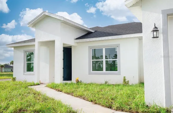 a view of front door and yard