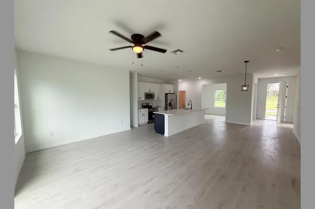 a view of an empty room with a window
