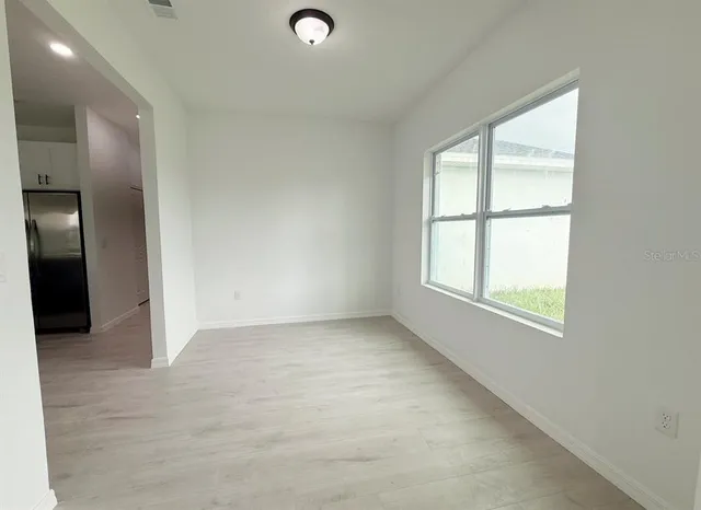 a view of a dining room with furniture