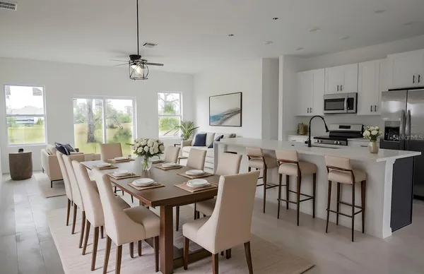 a kitchen with stainless steel appliances a sink a stove and microwave