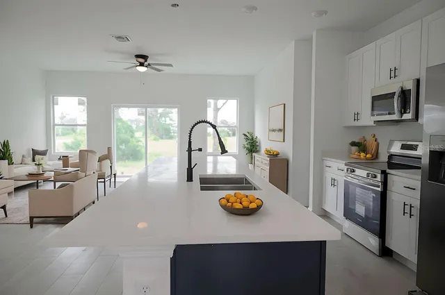 a bedroom with a bed and lamp with window