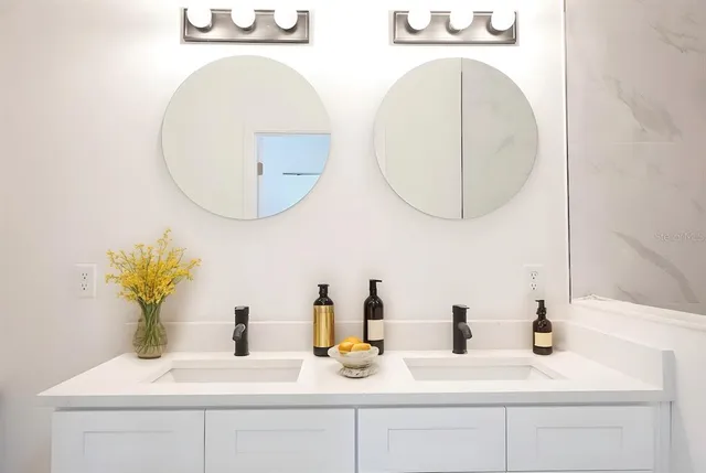 a bedroom with a bed and a potted plant