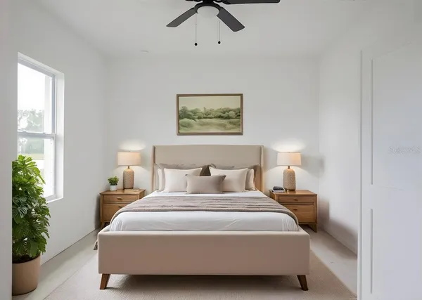 a bedroom with a bed and a window