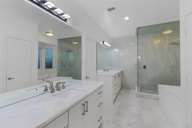 a bathroom with a bathtub and a shower