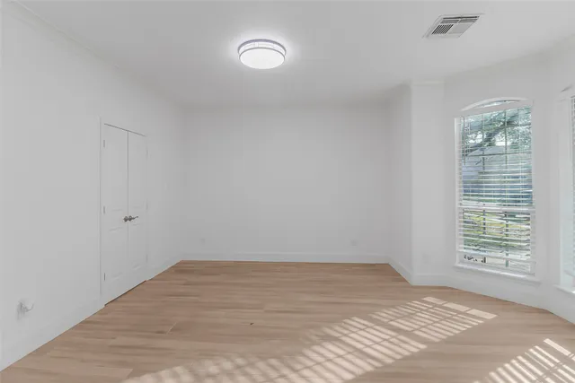 a view of a livingroom with a ceiling fan and window