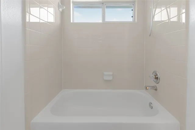 a view of a house with a yard and pathway