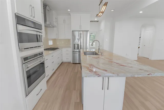 a view of a dining room with furniture and window