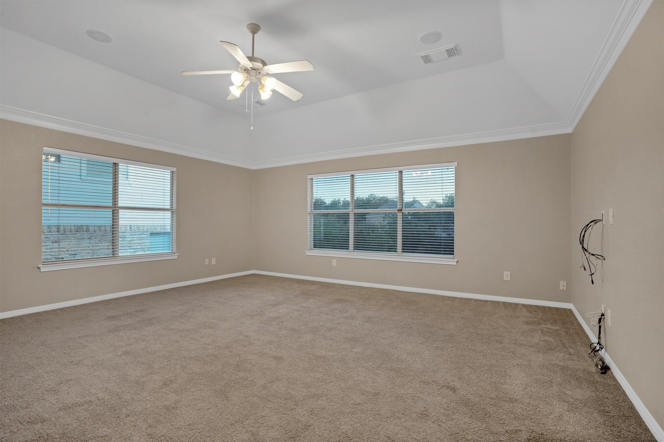 13013 Titus Court Austin, TX 78732 - Photo 14 of 30 an empty room with windows and chandelier fan