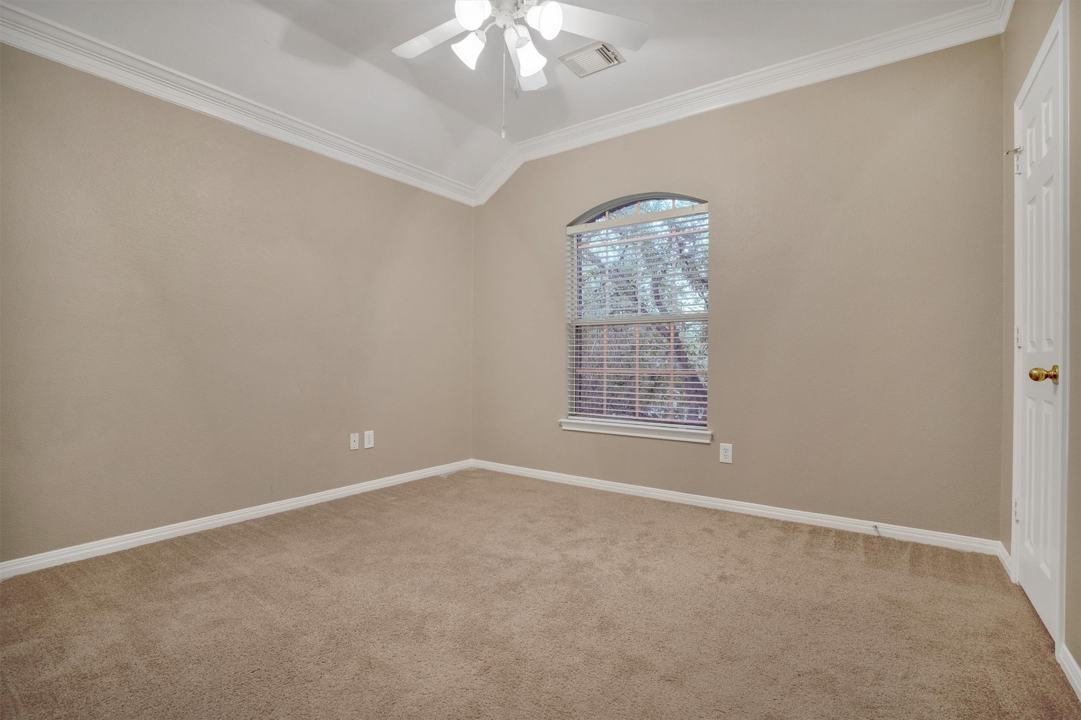 13013 Titus Court Austin, TX 78732 - Photo 18 of 30 an empty room with a chandelier fan and windows