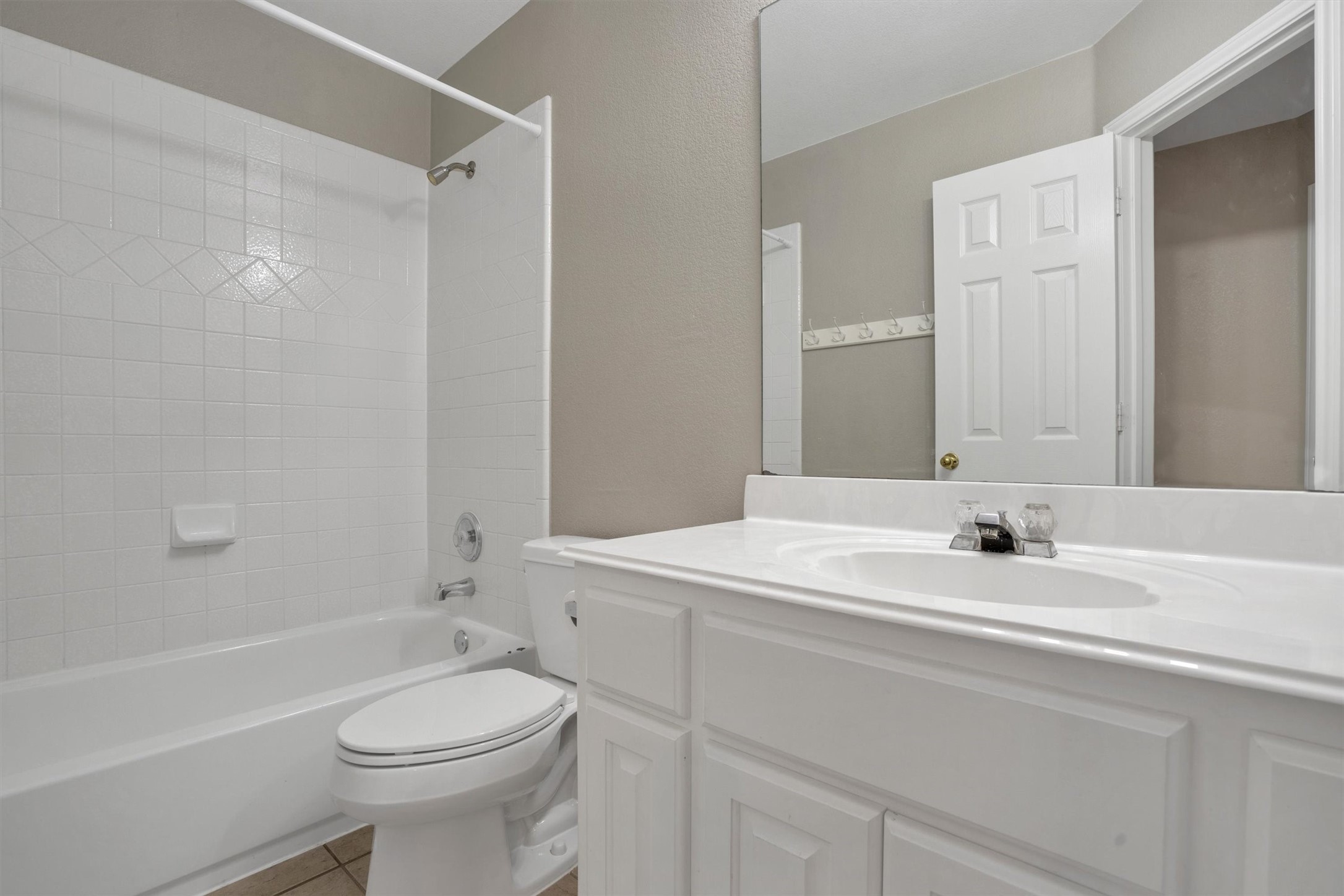 13013 Titus Court Austin, TX 78732 - Photo 24 of 30 a bathroom with a sink a toilet and a bathtub