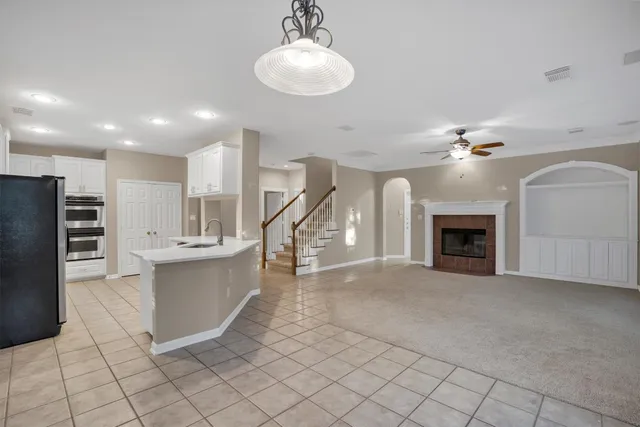 a view of a kitchen with furniture and a fireplace
