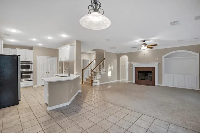 a view of a kitchen with furniture and a fireplace