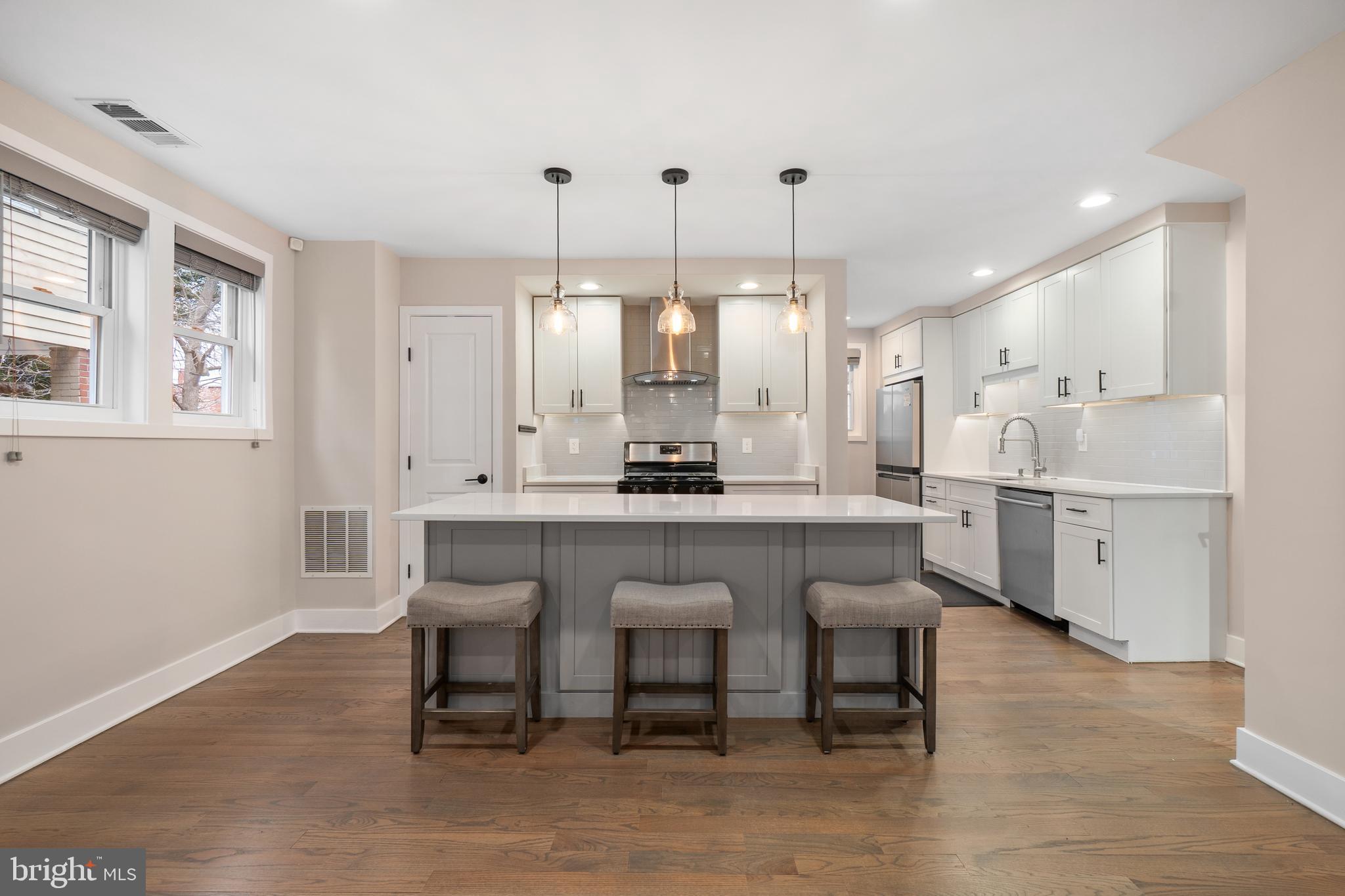 50 53rd Street Southeast Washington, DC 20019 - Photo 6 of 35 a kitchen with stainless steel appliances granite countertop a table chairs sink and cabinets