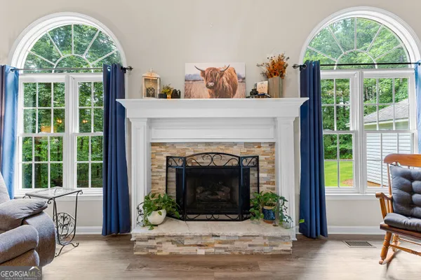 a living room with furniture and a fireplace