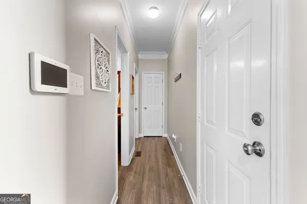 a bathroom with a granite countertop toilet sink and mirror
