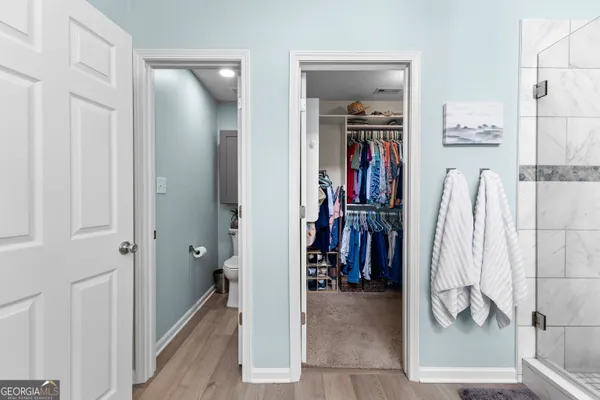 a bathroom with a double vanity sink and a toilet