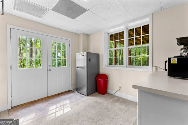 a spacious bathroom with a double vanity sink and a mirror