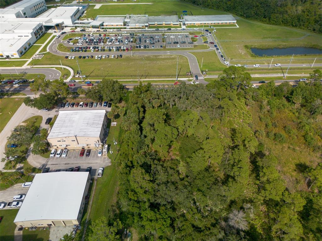 265 Enterprise Road Deltona, FL 32725 - Photo 18 of 24 an aerial view of residential houses with outdoor space and swimming pool