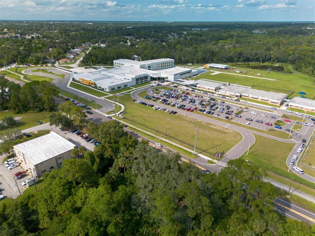 265 Enterprise Road Deltona, FL 32725 - Photo 24 of 24 a view of a swimming pool with lawn chairs