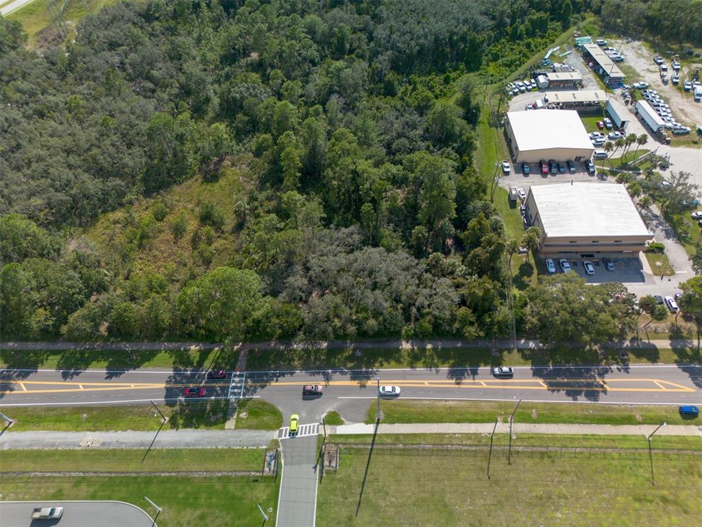 265 Enterprise Road Deltona, FL 32725 - Photo 5 of 24 a view of a swimming pool with a yard