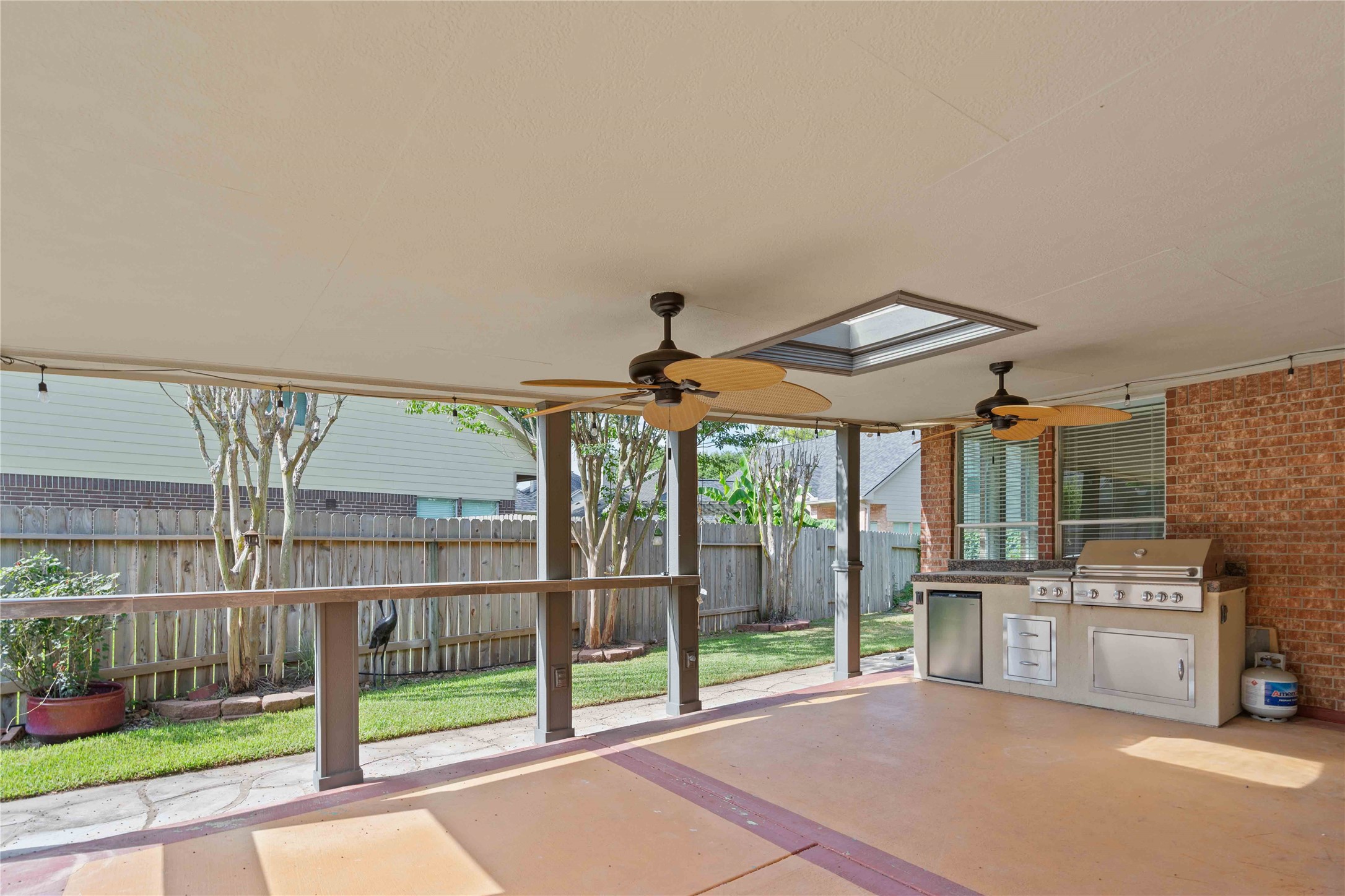 707 Lytton Springs Way Spring, TX 77373 - Photo 1 of 26 Covered back area with grill and refrigerator.