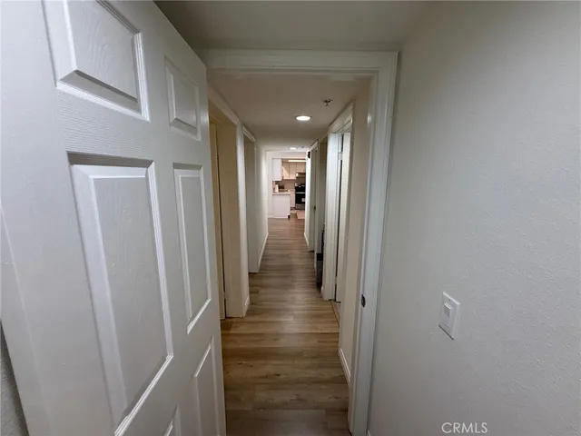 a bedroom with a bed and a mirror