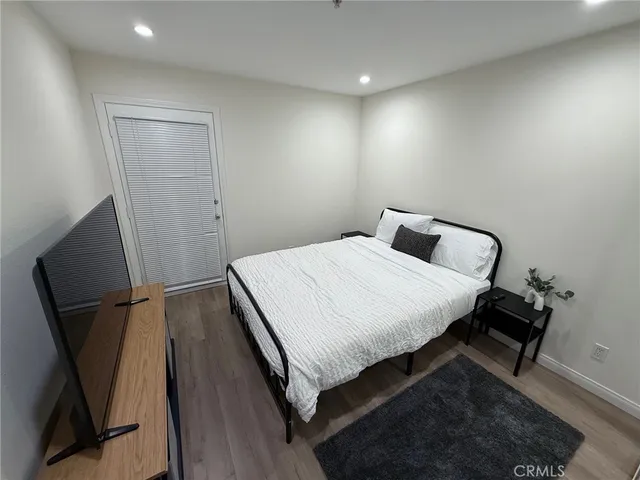 a bathroom with a sink vanity mirror and toilet