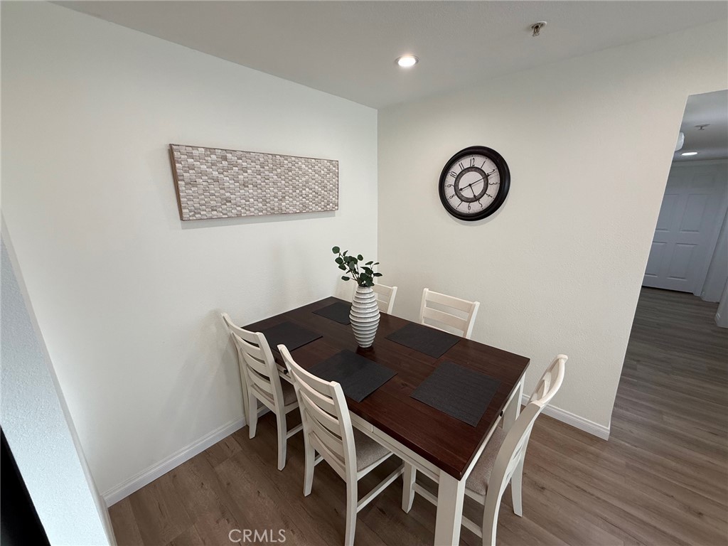 116 West Maple Street, Unit 6 Glendale, CA 91204 - Photo 7 of 19 a view of a dining room with furniture and wooden floor