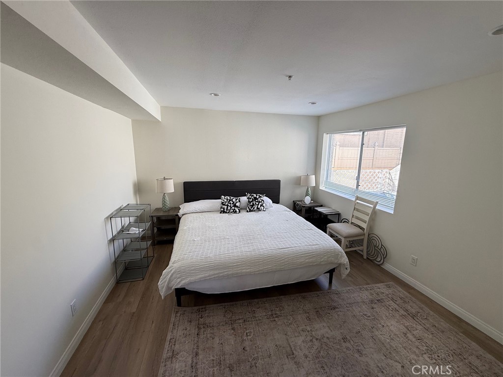 116 West Maple Street, Unit 6 Glendale, CA 91204 - Photo 9 of 19 a bedroom with a bed and window