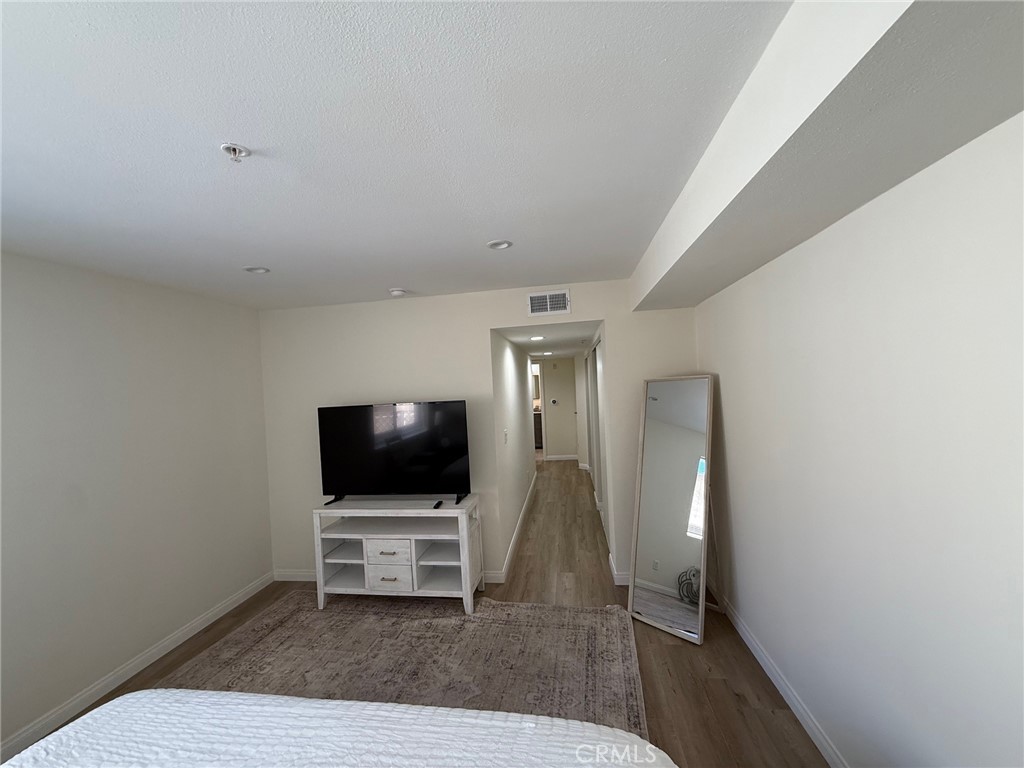 116 West Maple Street, Unit 6 Glendale, CA 91204 - Photo 10 of 19 a living room with furniture and a flat screen tv