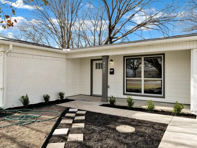 a front view of a house with yard