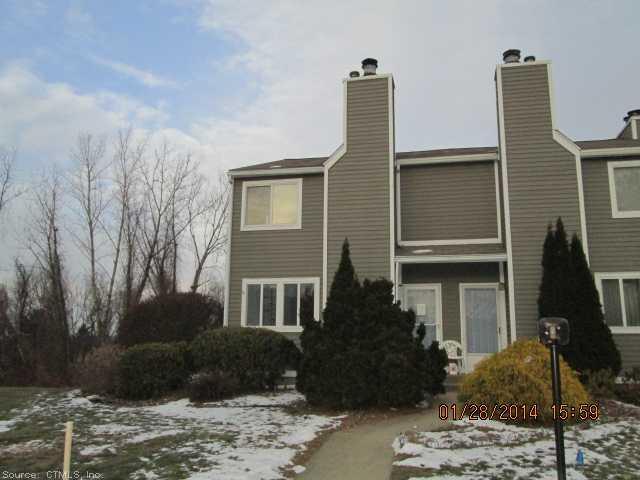 60 Old Town Road, Unit 75 Vernon, CT 06066 - Photo 1 of 1 a front view of a house with garden