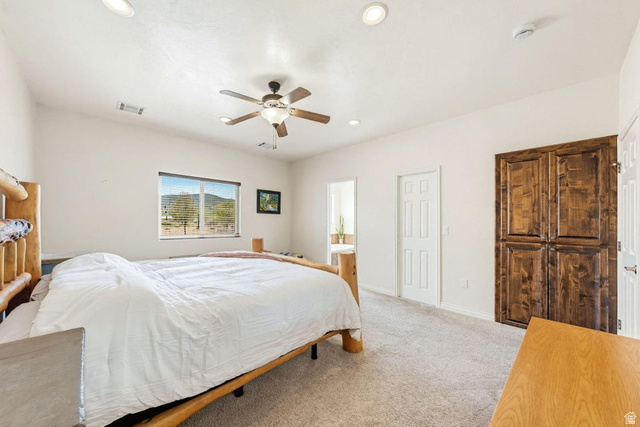 7776 Wagon Road East St. George, UT 84770 - Photo 23 of 76 Carpeted bedroom with a ceiling fan, ensuite bath, and recessed lighting