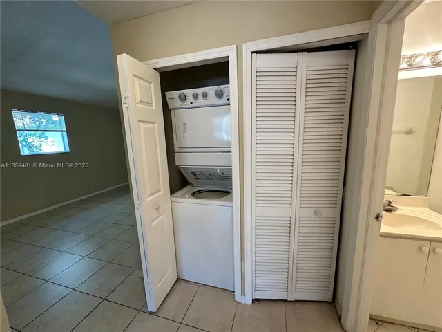 a utility room with closet dryer and washer