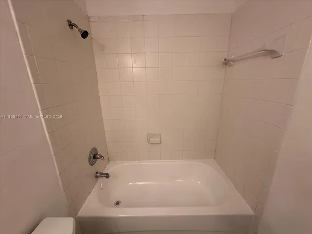 a white bath tub sitting in a bathroom