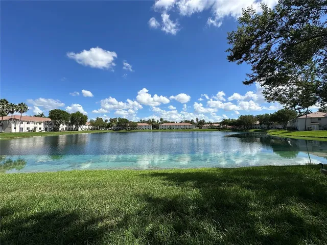 a view of a lake with a city